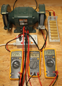 A bench grinder being measured with the three voltmeters method. The three multimeters show, from left to right, U1, U2 and U3. The resistor (top right) is 8.15Ohm 150W. (click to enlarge)