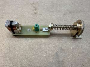 The electromagnet on his support PCB, the LED and the fine-pitch screw to adjust its position. (click to enlarge)