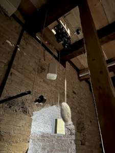 The synchronization system of the clock of the Castle of Burgdorf. Please note the pendulum sensor at the top and the electromagnetic pendulum catch system on the left. (click to enlarge)