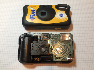 Picture of a disposable camera, where a suitable transformer can be found, disassembled (click to enlarge)