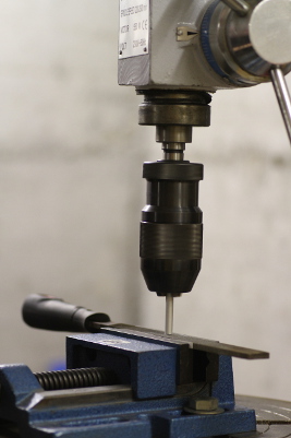 Facing the rod on the drill-press by drilling against a flat file.