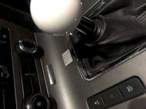 The new H-pattern placed in front of the shift lever. (click to enlarge)